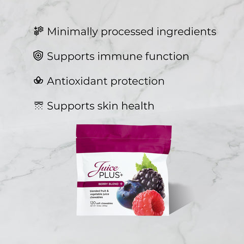 Juice Plus+ Berry Blend package on a marble background with text about product benefits.