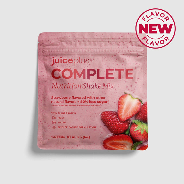Juice Plus+ Complete Nutrition Shake Mix package with strawberries on a gray background