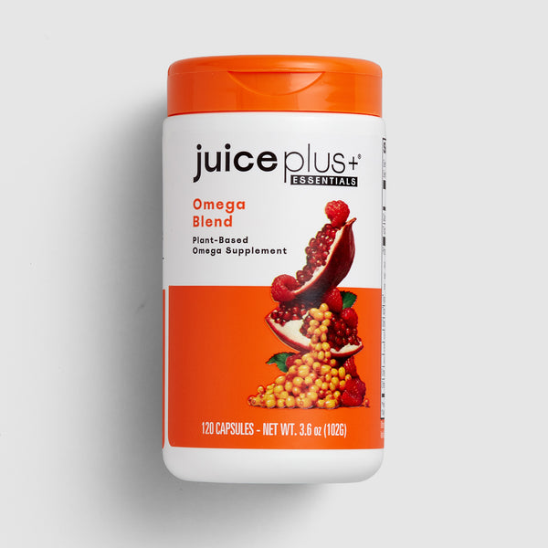Juice Plus+ Omega Blend supplement container on a light gray background