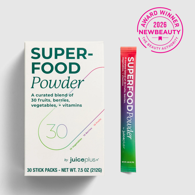 Superfood powder package with a stick pack on a white background, featuring the Juice Plus+ brand.