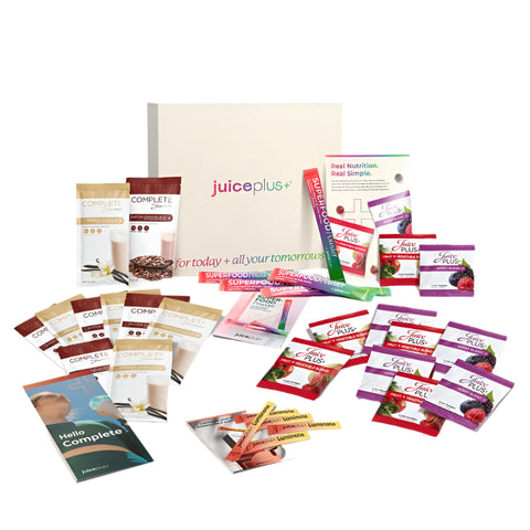 A collection of Juice Plus+ products displayed on a white background, including various packs and sachets.