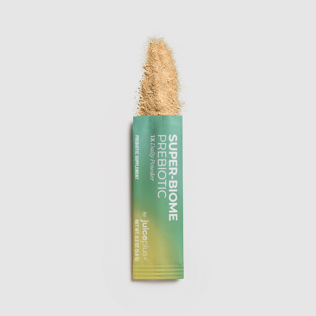 Juice Plus+ Super-Biome Prebiotic Powder packaging with a light beige powder on a white background