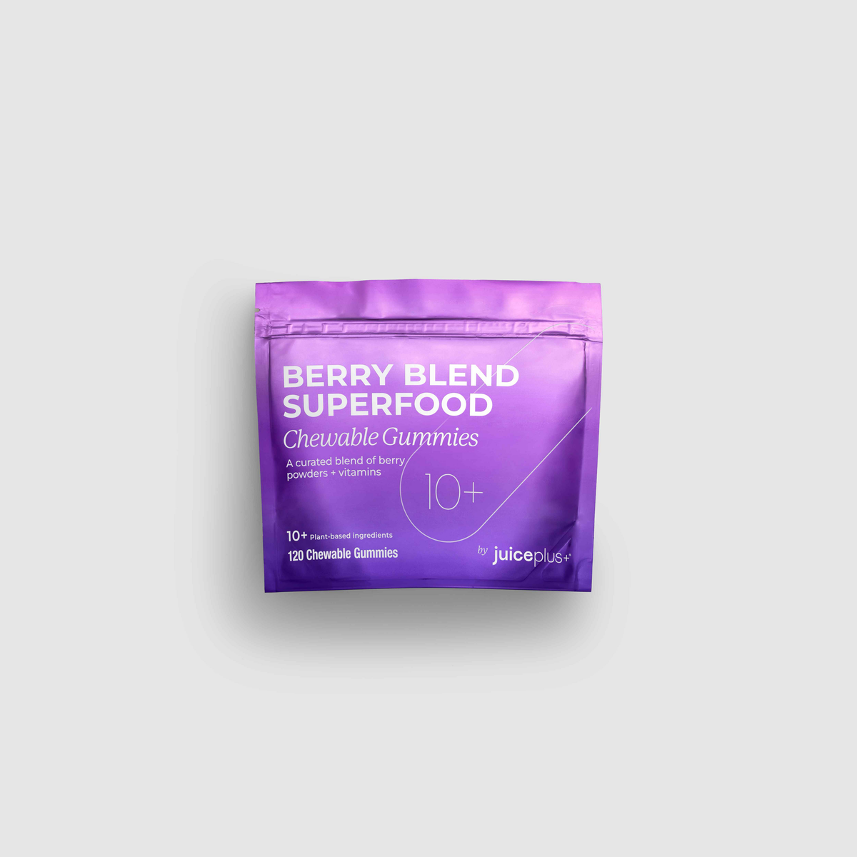 Purple package of Berry Blend Superfood Chewable Gummies on a light gray background