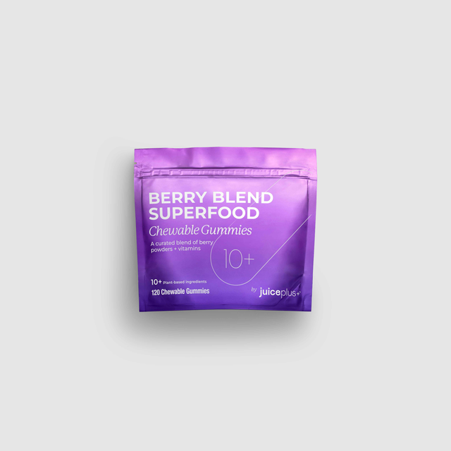 Purple package of Berry Blend Superfood Chewable Gummies on a light gray background